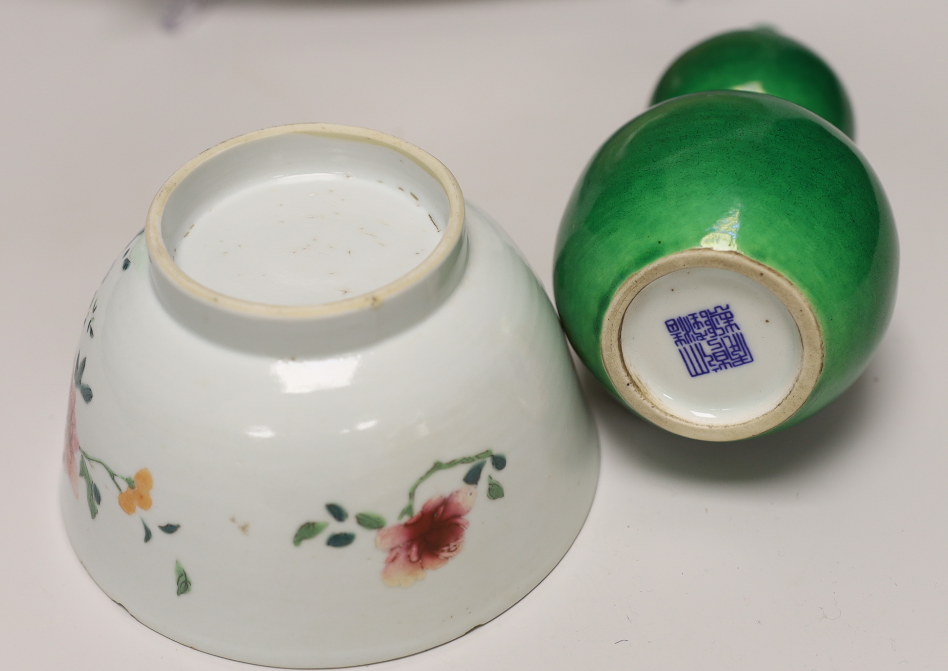 A Thai Sawankhalok celadon dish, 35cm, four rice and tea bowls and a double gourd vase